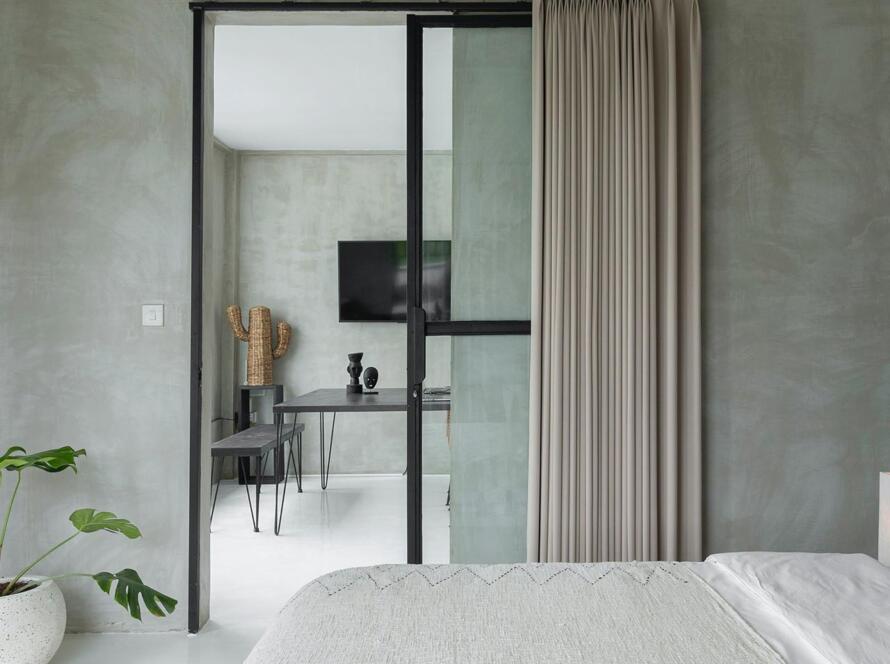 Minimalist bedroom with beige curtain